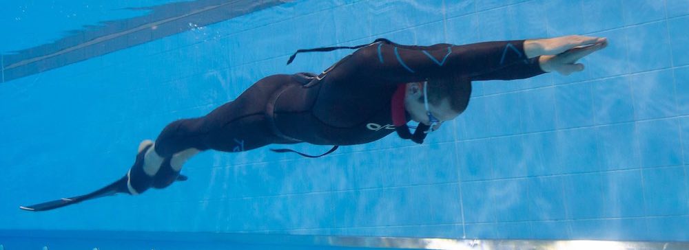 Freediver with monofin in the pool